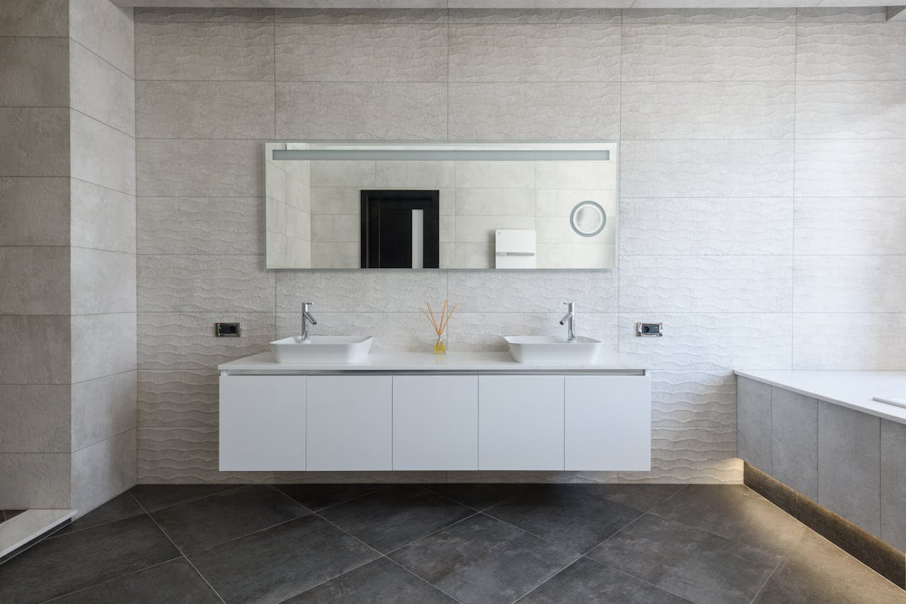 hero-services Elegant bathroom with minimalist design and modern fixtures.